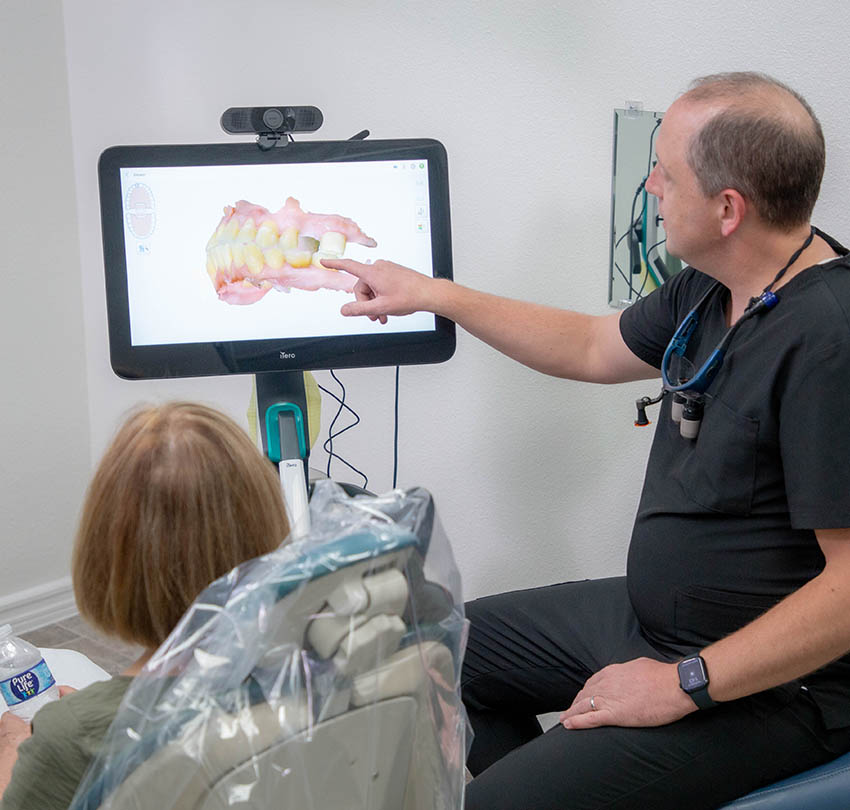 A Premier dentist reviewing a digital dental scan