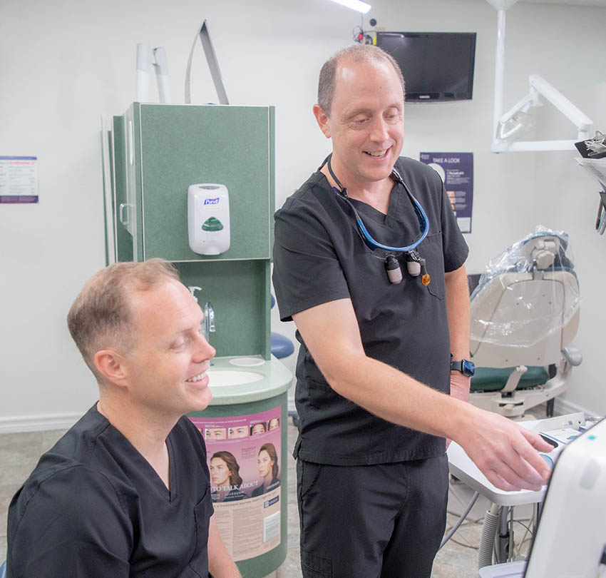 Premier dentists discussing treatment planning together